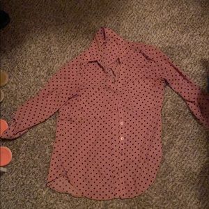 A polka-dotted pink 2/4 sleeve shirt